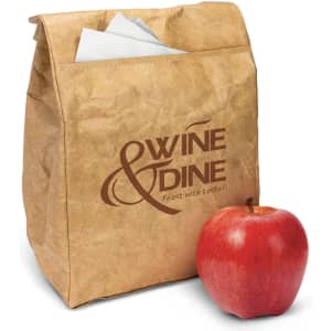 A brown paper lunch bag with a logo and an apple beside it. The bag includes folded napkins inside.