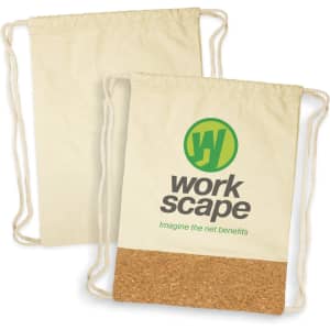 A drawstring backpack in cream with a cork base, featuring a logo in green and black.