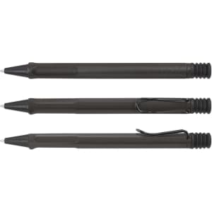 Three Lamy Safari Pens in a dark green color, featuring a plastic body, ergonomic grip, and metal clip.