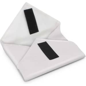 A reusable food wrap is displayed, featuring a white fabric design with black velcro closures.
