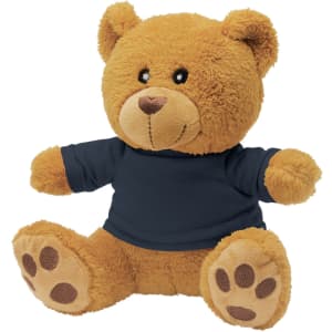 A teddy bear plush toy in brown with a navy blue shirt and soft paw details. It has a friendly facial expression.