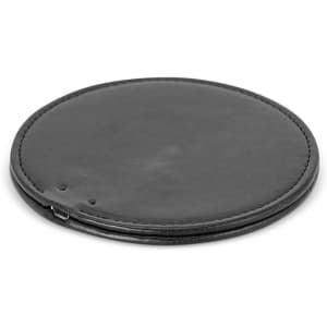 A round, black wireless charger with a smooth surface and a micro USB port.