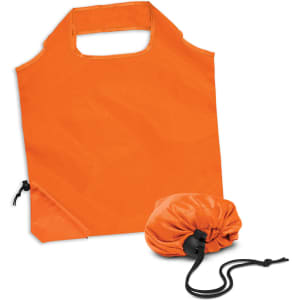 An orange reusable grocery bag with a drawstring pouch for compact storage. Features a logo on one side.