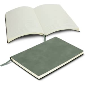 A soft cover notebook in green, open to reveal lined pages and a ribbon bookmark. Branding is present on the cover.