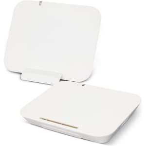 A white wireless charging stand with a sleek, minimalist design, featuring a raised base for stability.