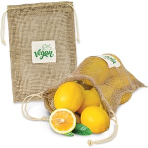 A jute net produce bag in tan containing yellow lemons, with one lemon and leaves displayed outside the bag.