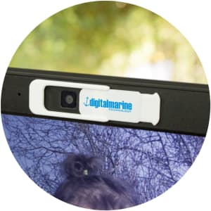 A webcam cover featuring a white design with a blue logo, designed to slide open and closed over a camera lens.
