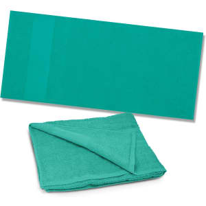 A teal beach towel neatly folded with a flat, unfolded view beside it. The towel has a logo.
