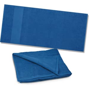 A Dune Beach Towel in a solid blue color, available in two views: one flat and one folded.