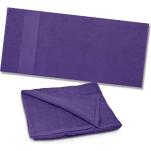 A purple Dune Beach Towel, displaying both a folded and unfolded view, designed for leisure and outdoor use.