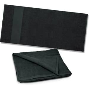 A dark green beach towel displayed flat, with a folded version showing its texture and thickness. It features a logo.