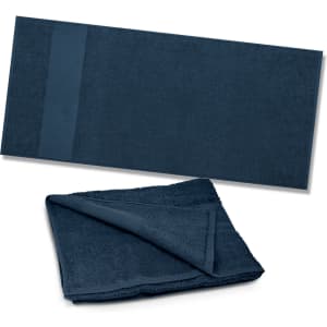 A dark blue Dune Beach Towel with a textured surface and a smooth band at one end, folded and laid out flat.