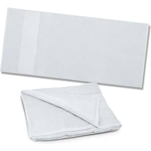 A soft, light grey beach towel folded in half, featuring a subtle logo on one side.