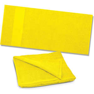 A bright yellow beach towel, folded and unfolded, made from soft, absorbent material.