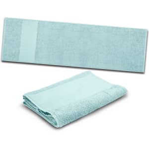 A light blue Enduro Sports Towel is displayed, showcasing its soft texture and generous size, folded for convenience.