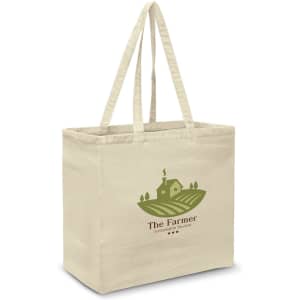 A beige cotton tote bag with two handles and a logo featuring a farm scene.