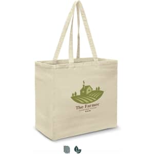 A beige cotton tote bag with a green logo depicting a farmhouse and fields. Features long handles for easy carrying.
