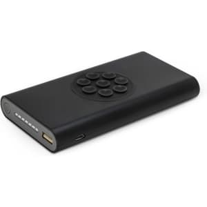 A black wireless power bank featuring a circular control panel and USB ports. It has a sleek, minimalist design.