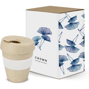 A drink bottle in a natural colour with a white silicone band, packaged in a decorative box featuring floral designs.