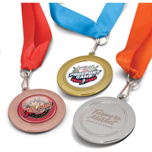 Three medals with coloured ribbons—gold, silver, and bronze—featuring various logos.