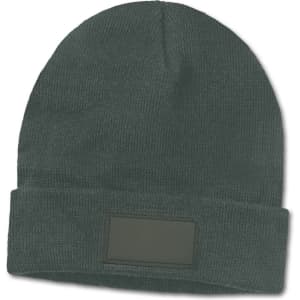 A green beanie with a folded cuff and a blank patch for customization.