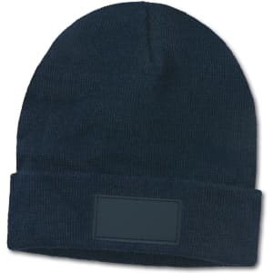 A navy blue beanie with a fold-up cuff and a blank patch for customization.