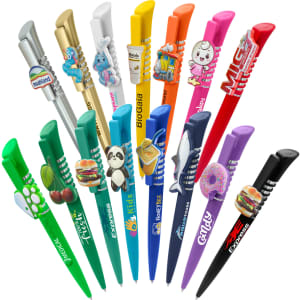 A collection of colourful plastic pens in various designs, including animal and food themes, some featuring logos.