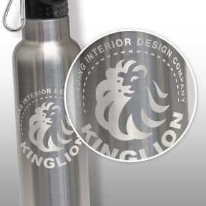 A drink bottle made of stainless steel, featuring a black lid, presented in a cylindrical brown cardboard packaging.