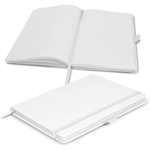 A white notebook with lined pages, featuring a ribbon marker and a cover with an embossed logo.