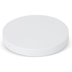 A round, white wireless charger with a smooth finish and a minimalistic design, featuring a logo.