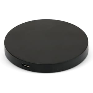 A round black wireless charger with a USB-C port visible on the side. It features a simple and sleek design.