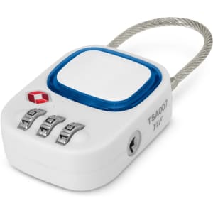 A white TSA lock with a blue button and a braided steel cable, featuring a combination dial and a small logo.