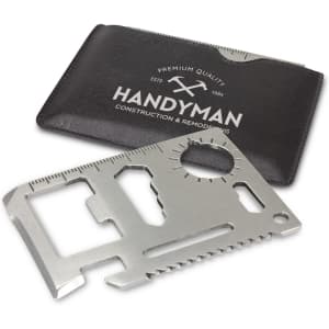 A multi-tool card made of silver metal, displayed with a black card holder featuring a logo.