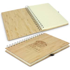 A bamboo notebook with a spiral binding, featuring a natural wood finish and lined pages. It includes a branded logo.