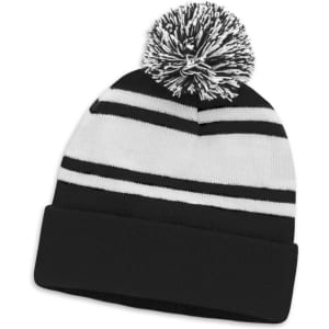 A black and white striped beanie with a pom pom on top. Features a knitted design and a folded brim.