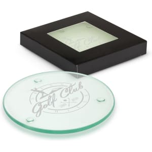 A round glass coaster set in a black box, featuring a logo design in grey on a clear surface.