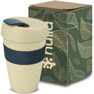 A drink bottle in a natural beige colour with a navy band, accompanied by a cardboard box featuring leaf designs.