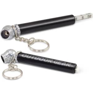A tyre pressure gauge key ring in black and silver, featuring a key chain and a silver cap.