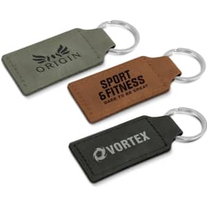 A set of three key rings in green and brown, featuring different shapes and branding.