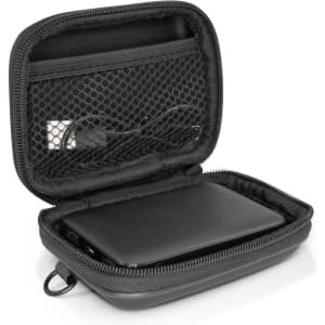 A black power bank is neatly enclosed in a zippered case with a mesh pocket and cables inside.