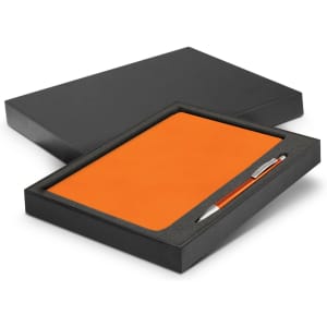 An orange notebook and silver pen in a black gift box, suitable for office or business use.