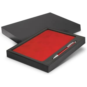 A red notebook and silver pen set presented in a black gift box.