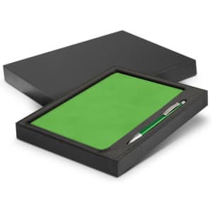 A green notebook and silver pen set displayed in a black gift box.