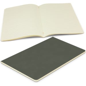 An open green notebook with lined pages, resting above a closed version of the same notebook.