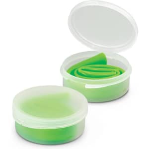 A silicone straw in a green storage case, featuring a transparent lid and a sleek design.