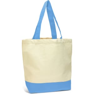 A canvas tote bag featuring a cream body and light blue bottom, complete with long blue handles and a logo.