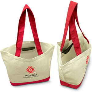 A canvas tote bag featuring a cream exterior with bright red handles and trim, along with a logo on the front.