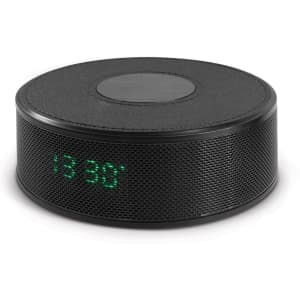 A round black wireless speaker with a textured surface and an LED display indicating time, featuring a logo.