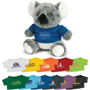 A koala plush toy with grey fur and white accents, wearing a blue shirt, displayed with various coloured shirts below.