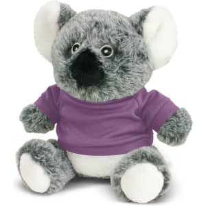A grey koala plush toy with black detailing, wearing a purple shirt, featuring a branding logo.
